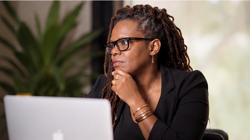 Resa Gooding reviewing results from an AI experiment